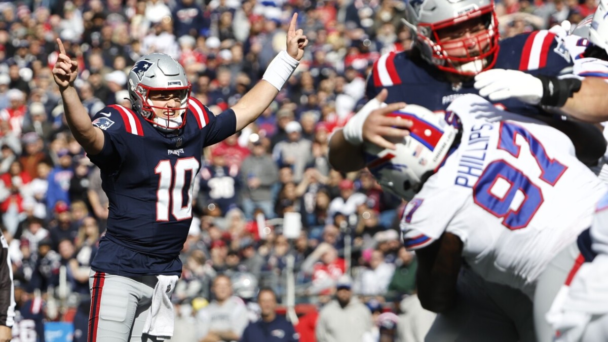 Mac Jones (10) celebrates a big play against the Buffalo Bills.